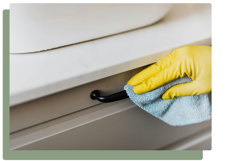 Cleaner dusting décor and accessible surfaces in a living area